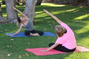 Women doing yoga poses on grass-Self Discovery Group Retreat