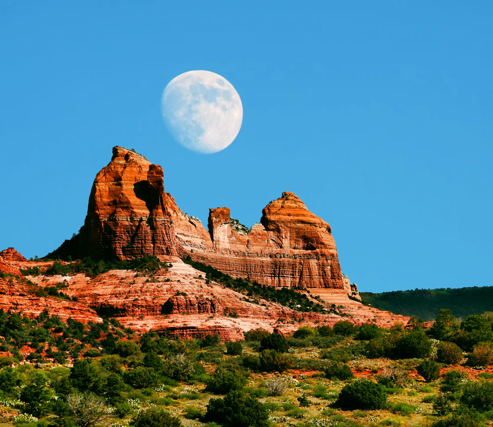Full moon over red rocks during Spiritual Retreats-SpiritQuest