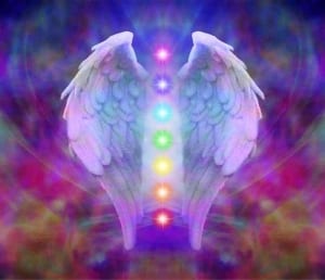 Colored chakra centers between white wings-stress management