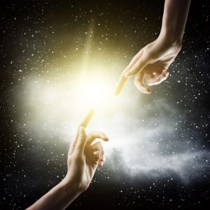 Two hands coming together in the Universe to touch fingertips-Breath
