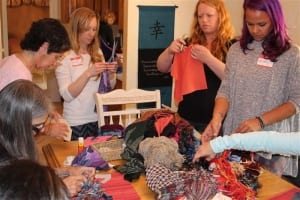 Group of women making soul pouches-women