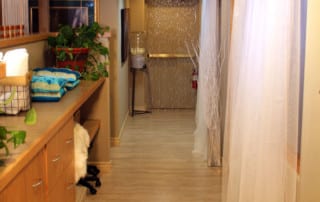 SpiritQuest Sedona Retreats retreat center hallway with hardwood floor and curtains
