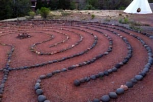 Outdoor stone walking labyrinth path in Sedona for mindful meditation and spiritual retreats.