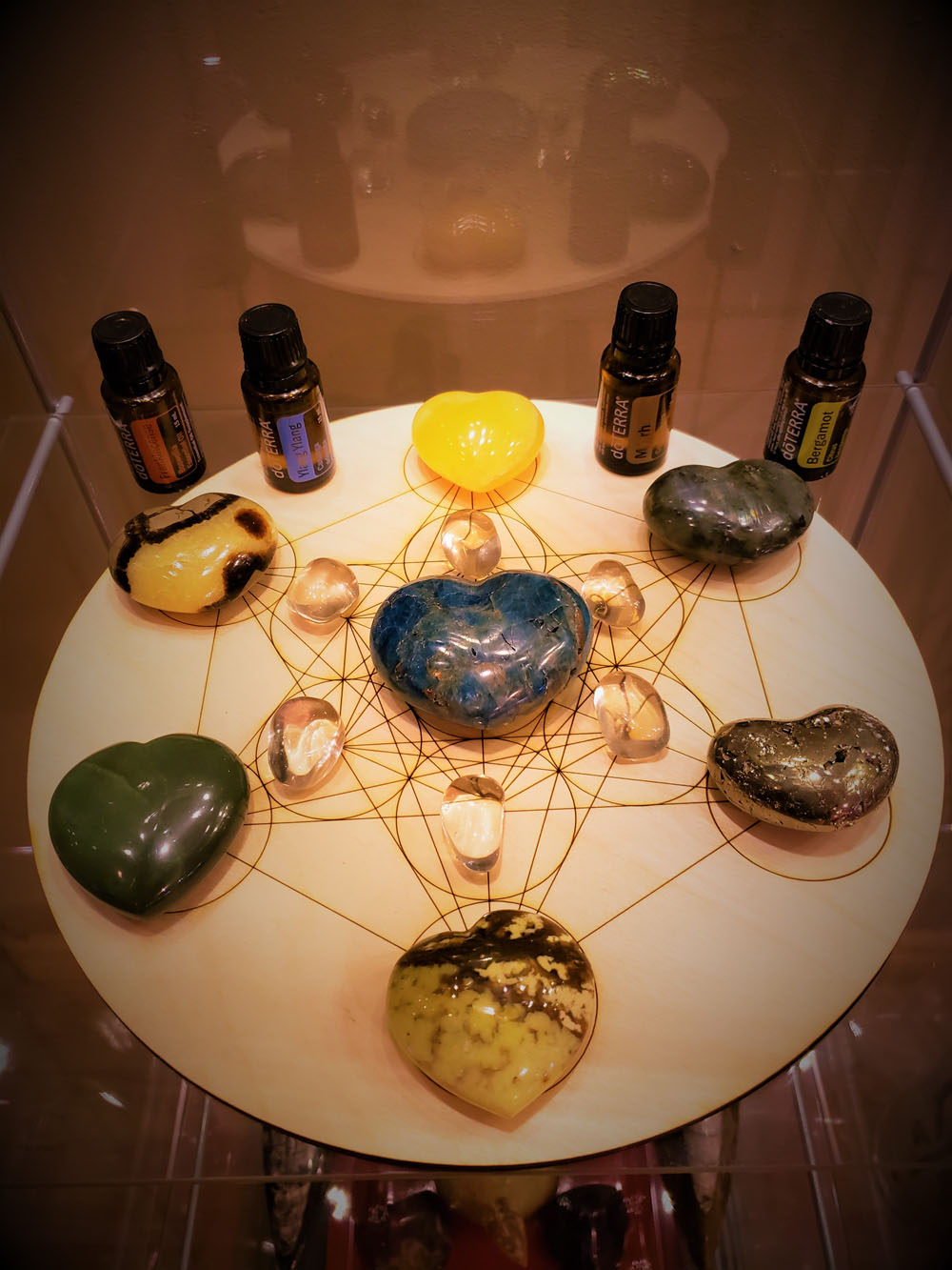 Esseintial oils and crystals on a round table-wellness retreat