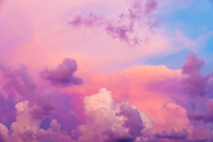 Pink and purple clouds floating in a blue sky-healing power of Sedona Vortex Energy
