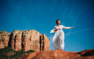 spiritual woman on rocks for sedona retreat