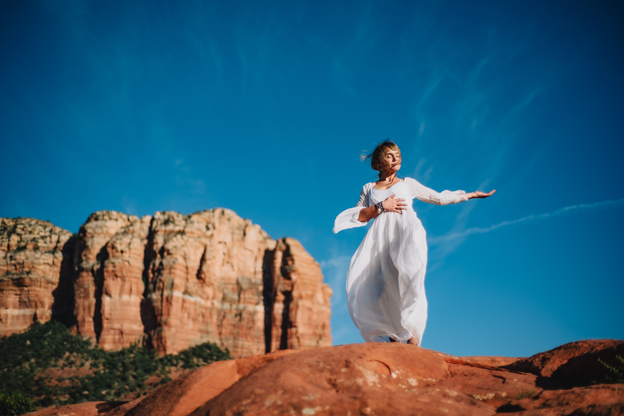 spiritual woman on rocks for sedona retreat