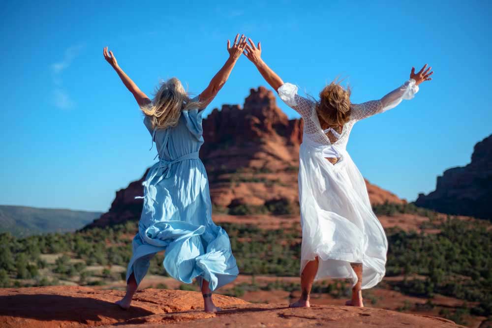 two women leaping for joy redrocks sedona az self love