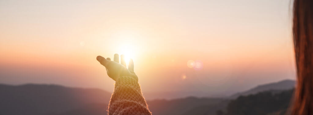 hand reaching for self-awareness and peace