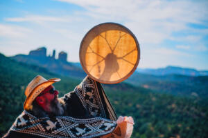 Practitioner Troy leading a Shamanic drum journey out on the red rocks of Sedona, Arizona.