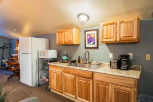 Fully equipped kitchen with full-sized refrigerator at the Sedona Sanctuary—ideal for all-inclusive retreat stays.