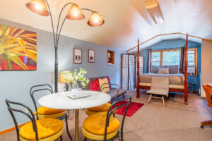 Open-concept studio apartment featuring a dining area and queen bed at the Sedona Sanctuary—perfect for all-inclusive SpiritQuest packages.