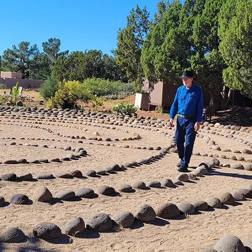 Man walks medicine wheel during shamanic retreat in sedona