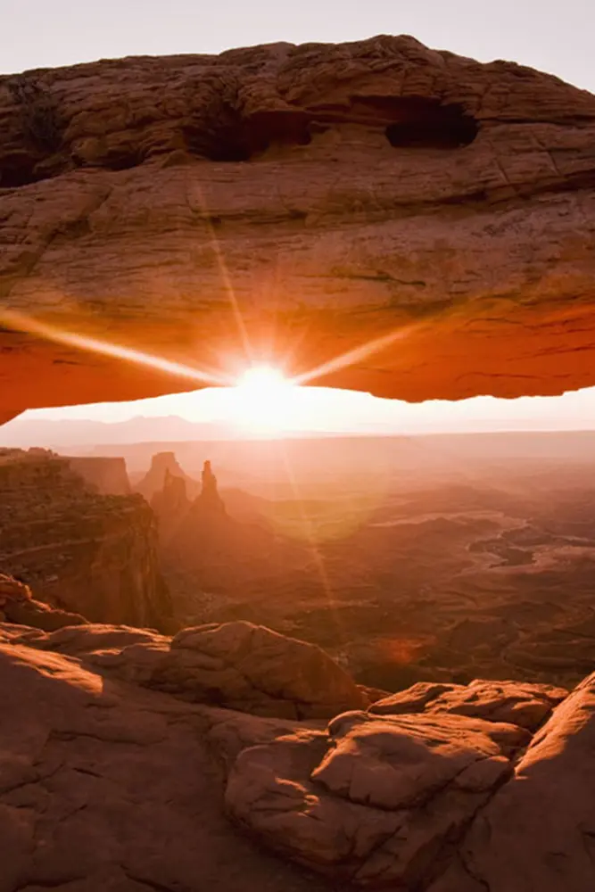 SpiritQuest Sedona retreat practitioner leading a guided vortex land journey on the red rocks during sunset