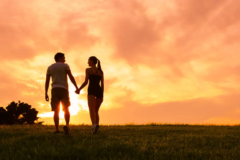 Couples-sunset-holding-hands-after-affair-recovery couples holds hands in sedona arizona after an affair recovery